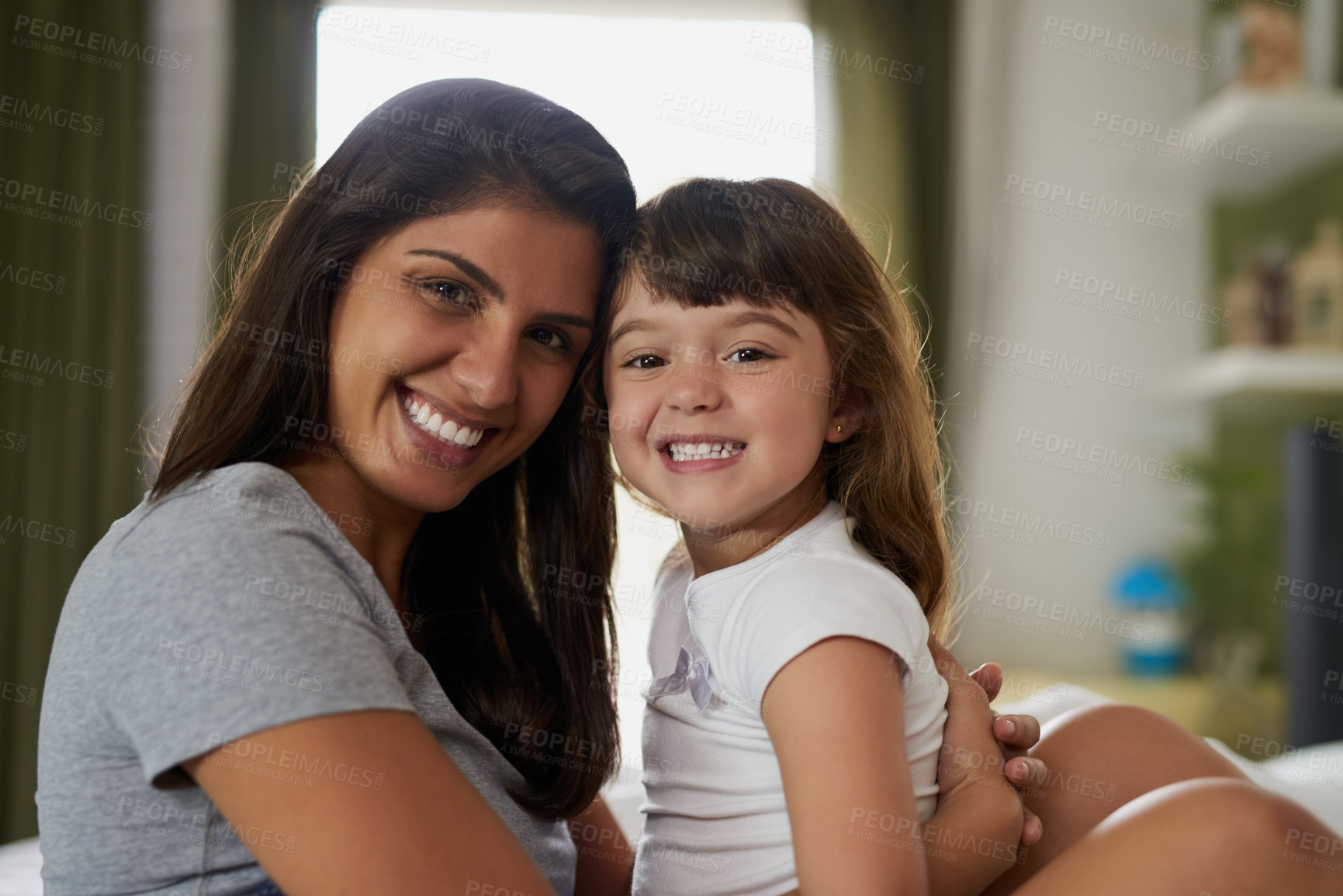 Buy stock photo Portrait of a mother and her little daughter bonding together at home