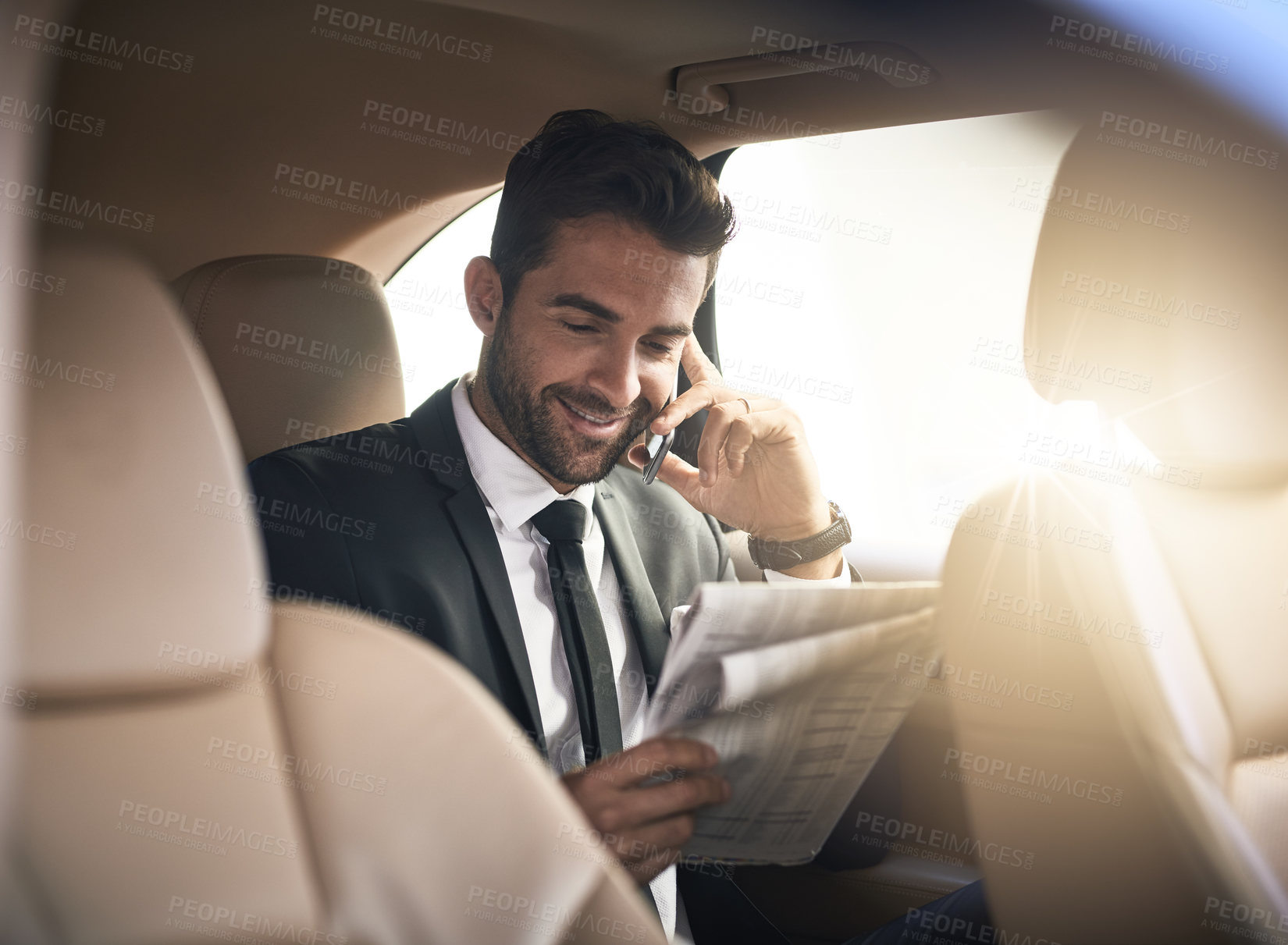 Buy stock photo Businessman, newspaper and reading in car with mobile phone, style or pride in formal clothes. Male person, transport and commute in morning as professional in investment banking for travel or luxury