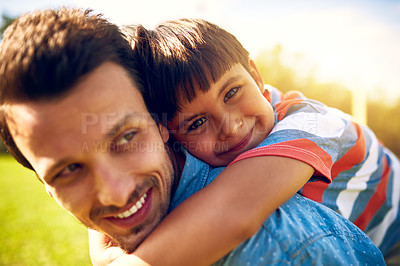 Buy stock photo Portrait of a little boy bonding with his father outdoors