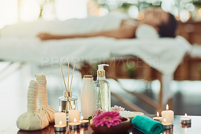 Buy stock photo Shot of various spa essentials arranged on a table