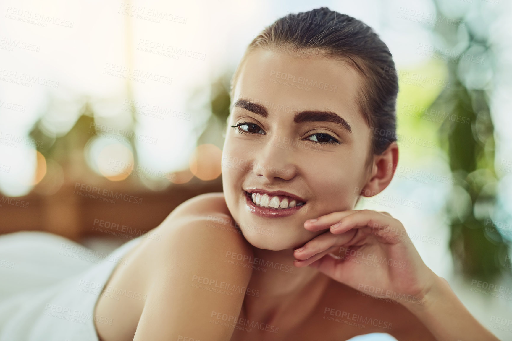 Buy stock photo Portrait of an attractive young woman getting pampered at a beauty spa