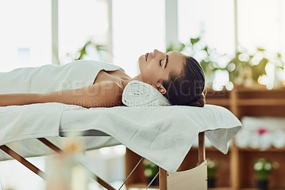 Buy stock photo Girl, sleeping and relax on towel at spa for luxury treatment, chemical peel and body massage for pamper. Woman, resting and wellness at beauty salon with zen, serene and cosmetic facial for skincare