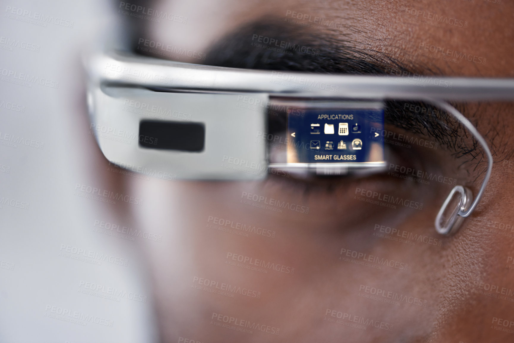 Buy stock photo Closeup shot of a young man using smartglasses to browse the web