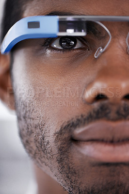Buy stock photo Closeup shot of a young man using smartglasses to browse the web