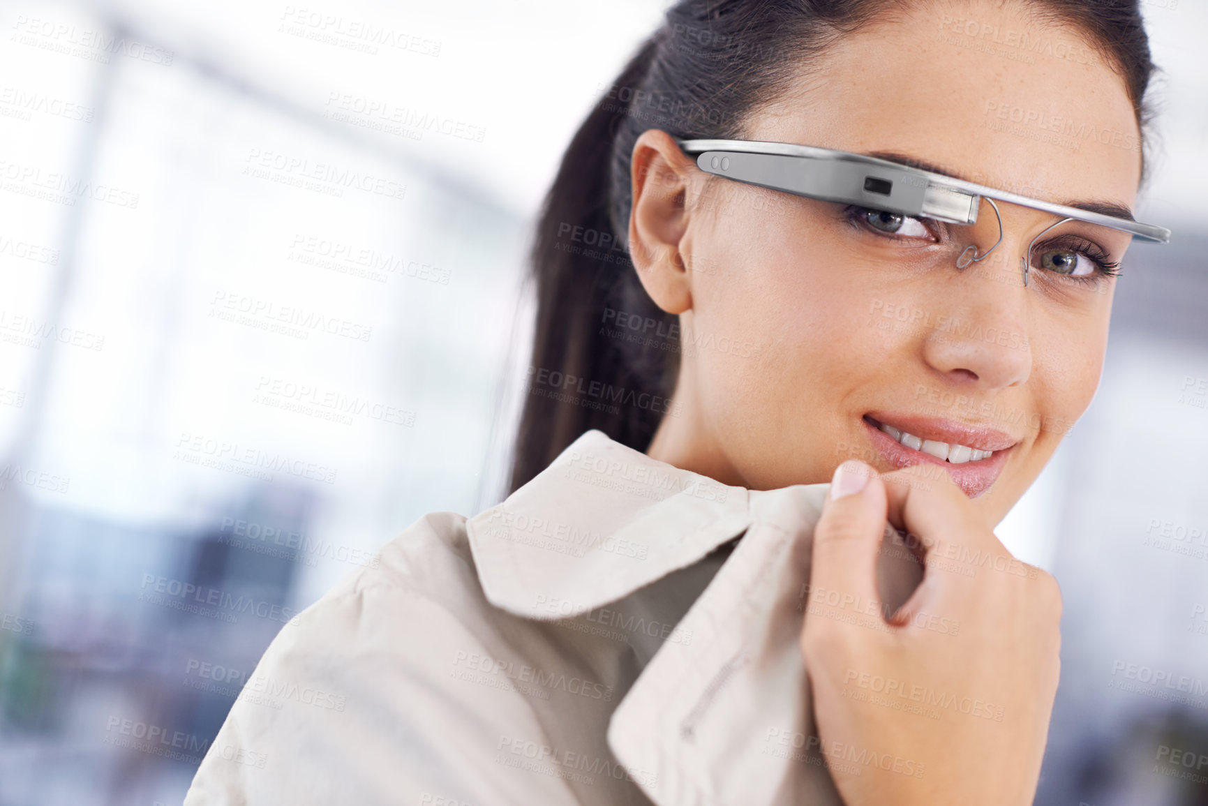 Buy stock photo Cropped portrait of an attractive young businesswoman using smartglasses in her office