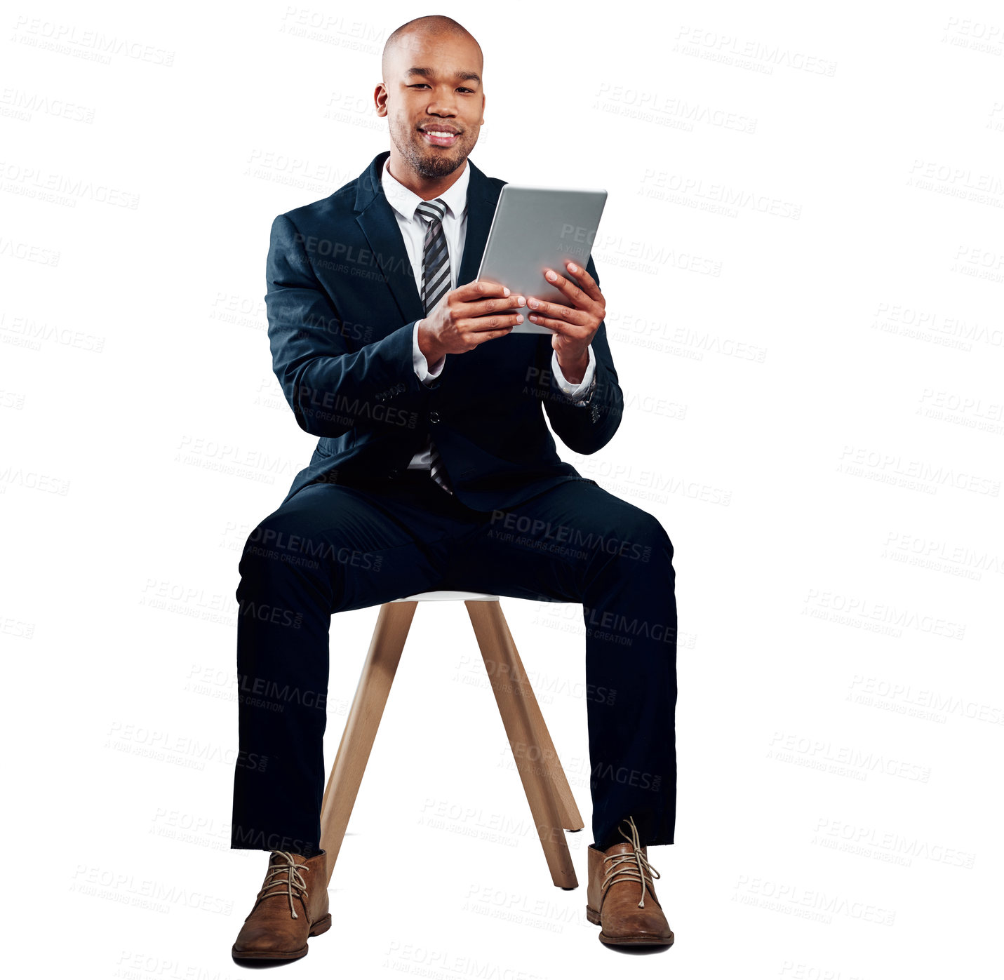 Buy stock photo Studio shot of a handsome young businessman using a tablet against a white background