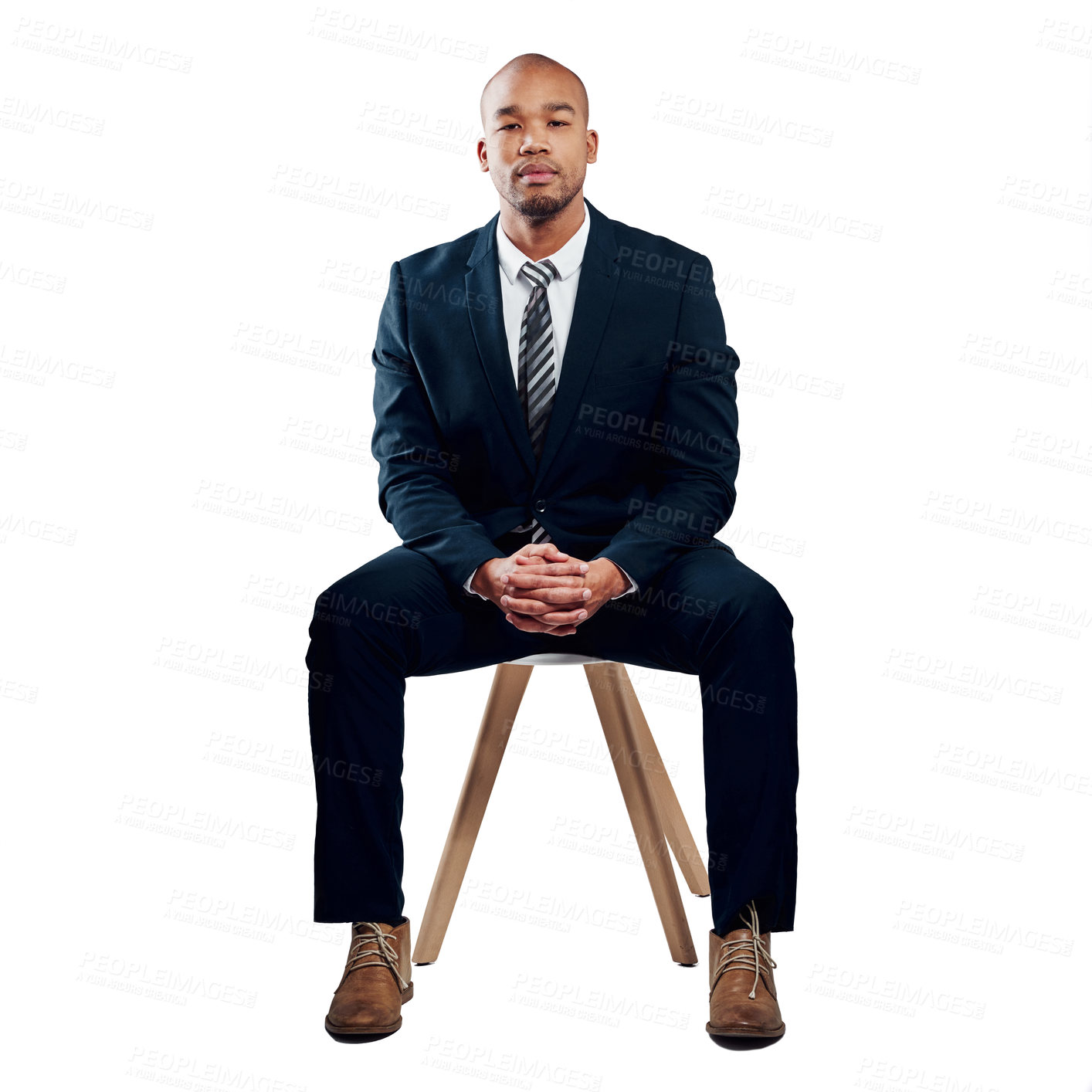 Buy stock photo Studio shot of a handsome young businessman posing against a white background