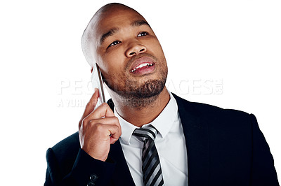 Buy stock photo Studio shot of a handsome young businessman on a call against a white background