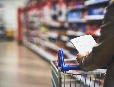 Buy stock photo Hands, person and shopping list at food shop with wheel cart for grocery, products and prices. Closeup, customer and supermarket or convenience store for retail cost, sale and discount or promotion