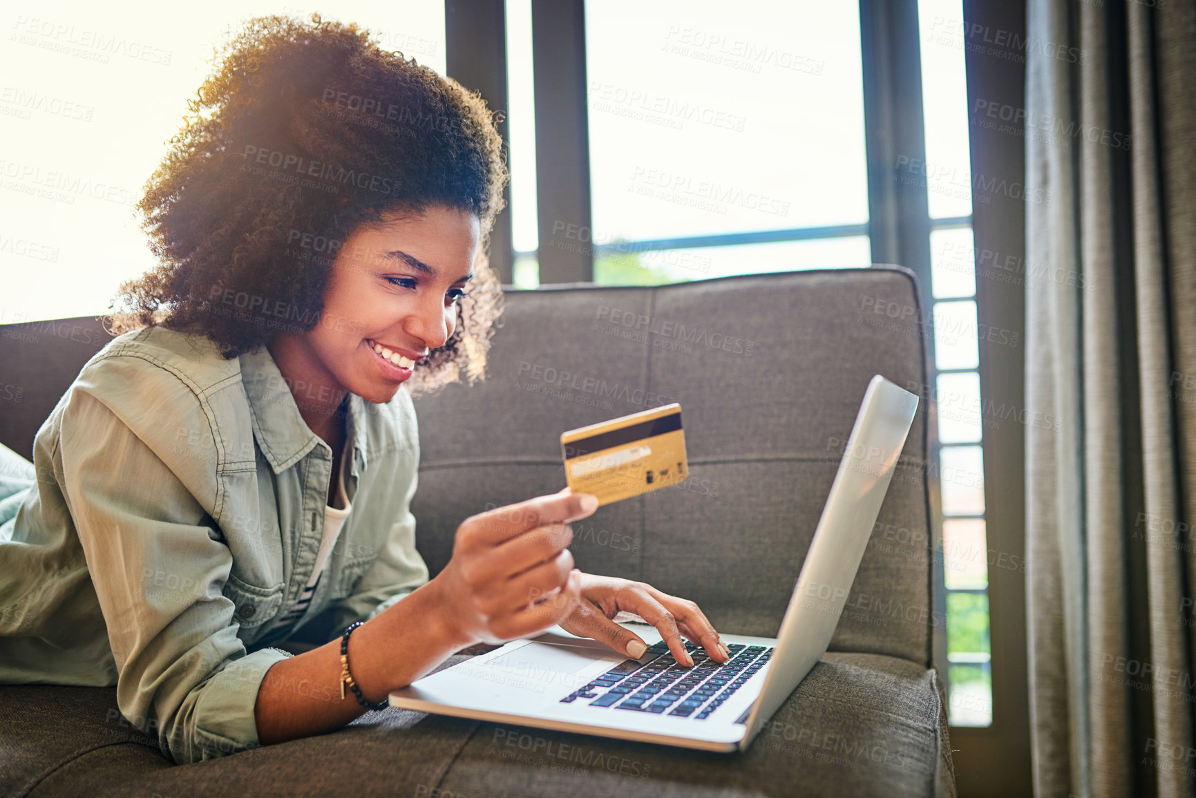 Buy stock photo Black woman, couch and happy on laptop with credit card for online shopping, payment and saving plan. Living room, smile and sofa at home for internet banking, budget and investment or finance