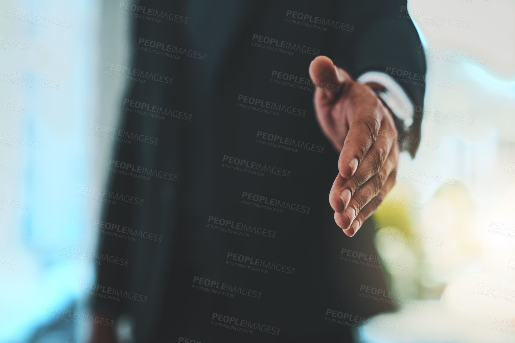 Buy stock photo Cropped shot of a businessman extending his arm for a handshake