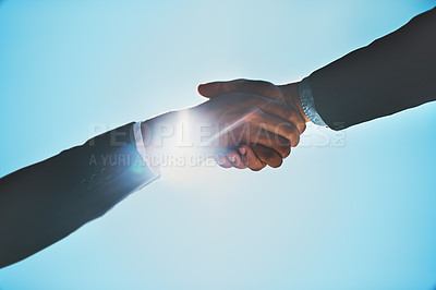 Buy stock photo Cropped shot of two businessmen shaking hands