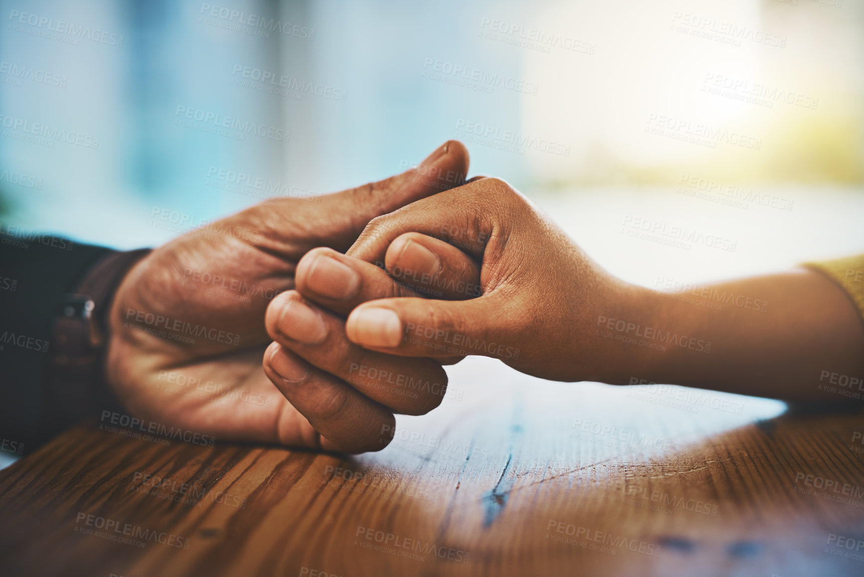 Buy stock photo Table, couple and holding hands with love in support for marriage, understanding and commitment. People, compassion and care with gesture of empathy for partnership, kindness and forgiveness at home