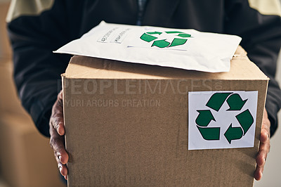 Buy stock photo Closeup shot of an unrecognizable courier holding packages for delivery