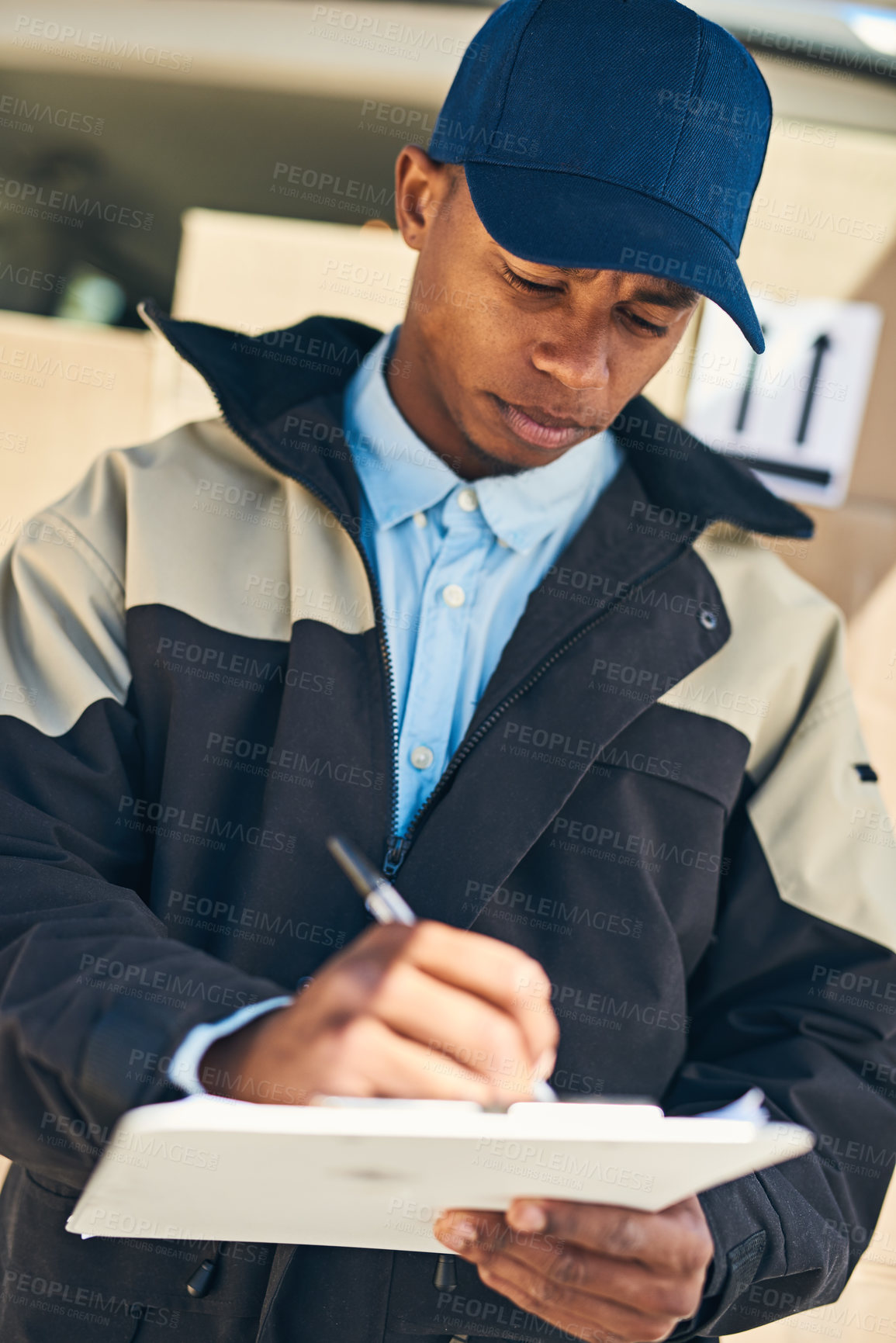 Buy stock photo Black man, writing and delivery with clipboard for checklist, supply chain or shipment in logistics. Young African Male person or courier guy with van for parcel, package or box for service in city