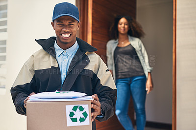 Buy stock photo Portrait of a courier making a home delivery to a customer