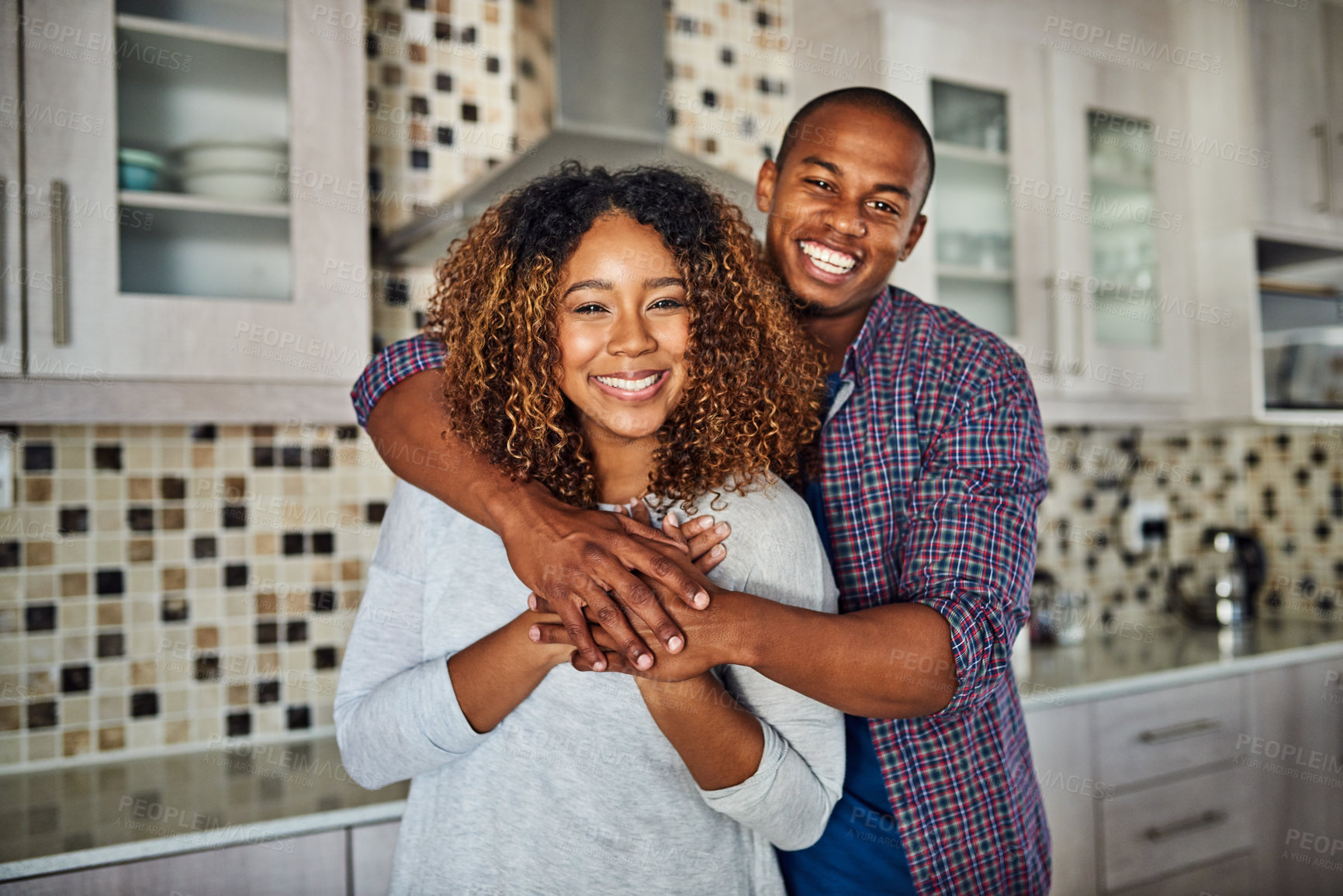 Buy stock photo Love, portrait and hug with couple in kitchen of apartment for bonding, happiness and support. Marriage, commitment and calm with man and woman at home for partner, wellness and trust together