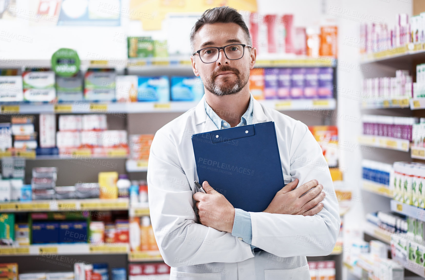 Buy stock photo Portrait of a confident mature pharmacist working in a pharmacy