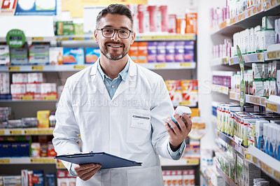 Buy stock photo Portrait of a mature pharmacist doing inventory in a pharmacy