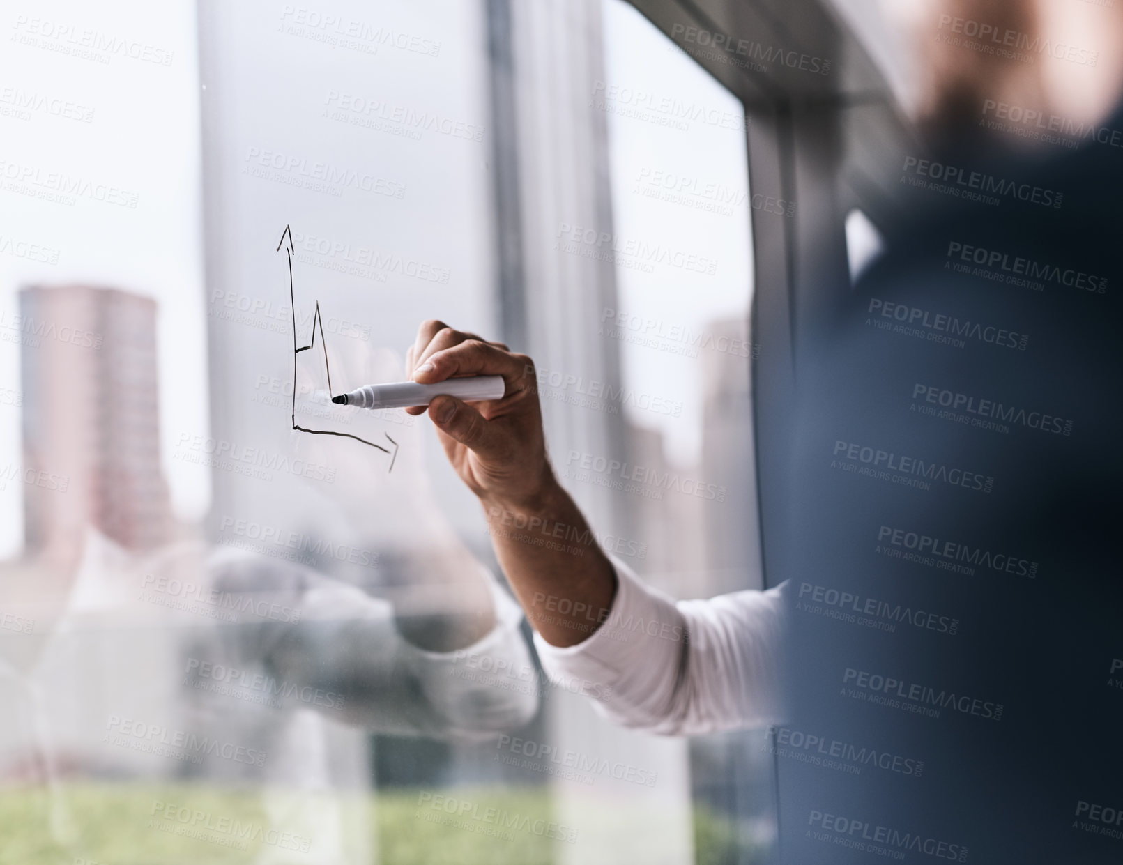 Buy stock photo Closeup shot of an unrecognizable businesswoman writing on a glass wall in an office