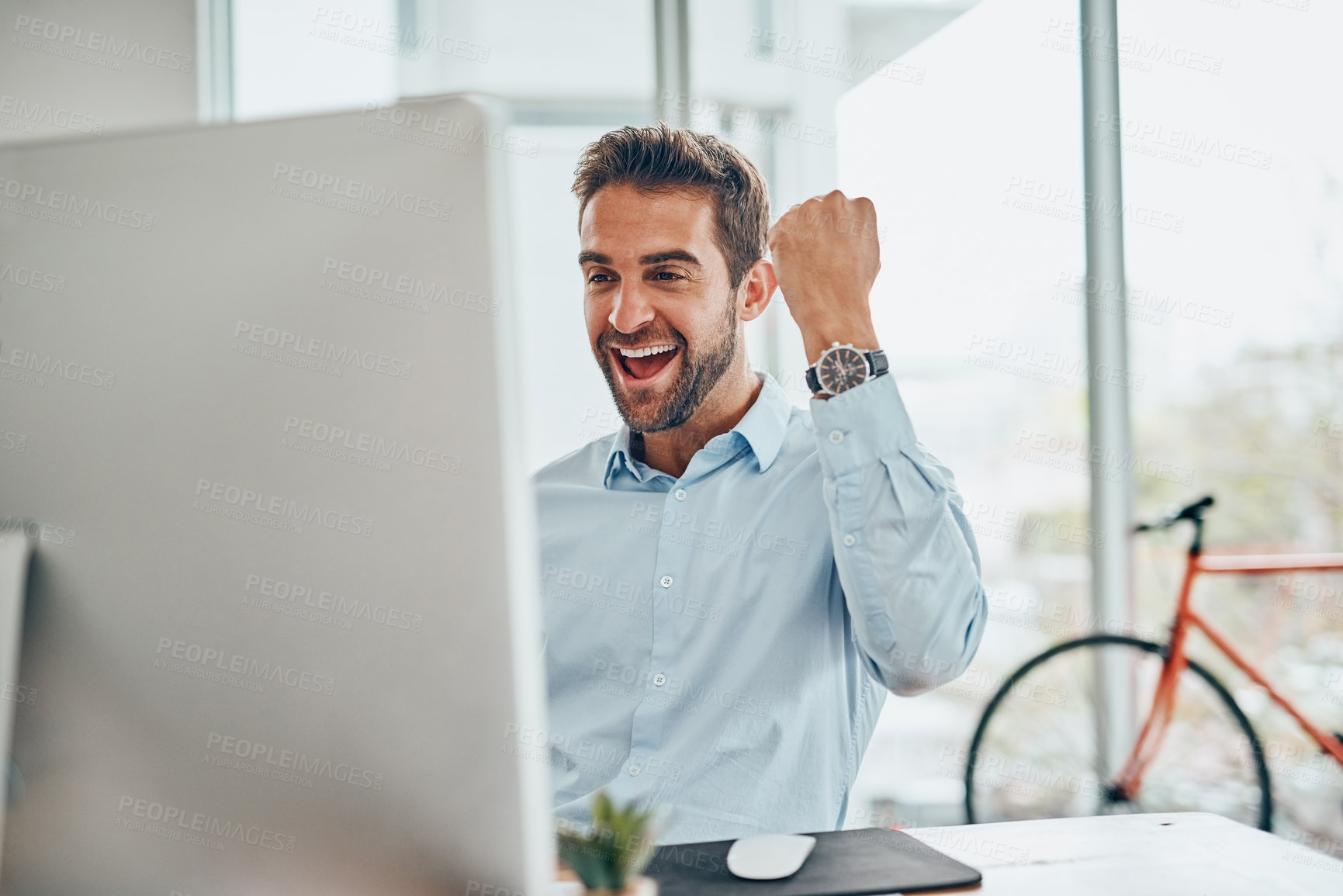 Buy stock photo Businessman, computer and winning with fist pump for promotion, good news or online deal at office. Young, excited or man with smile for victory, acomplishment or achievement by desk at workplace