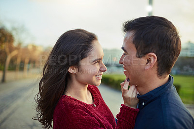 Buy stock photo Shot of a happy young couple spending a romantic day together outdoors