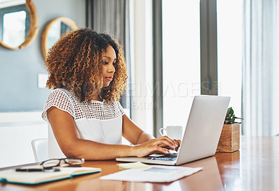 Buy stock photo Cropped shot of a young attractive businesswoman working in her office at home