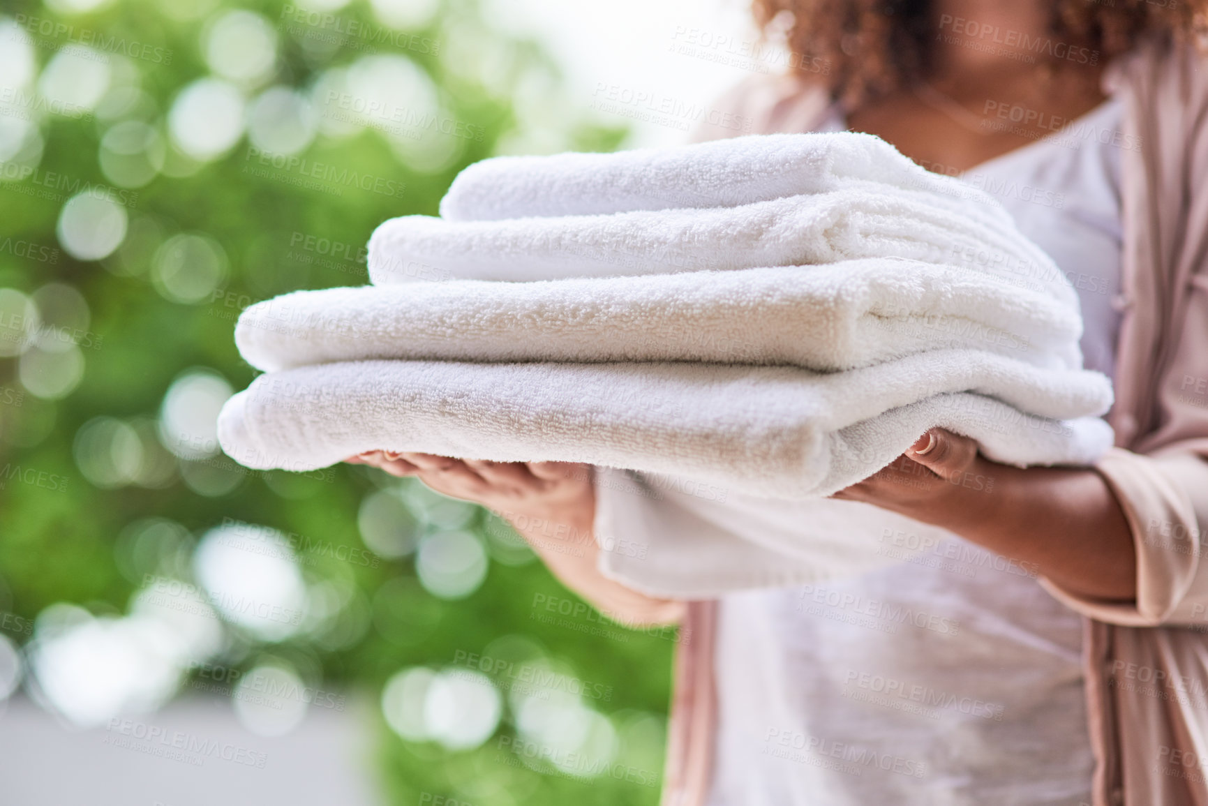 Buy stock photo Shot of an unrecognizable woman doing laundry at home