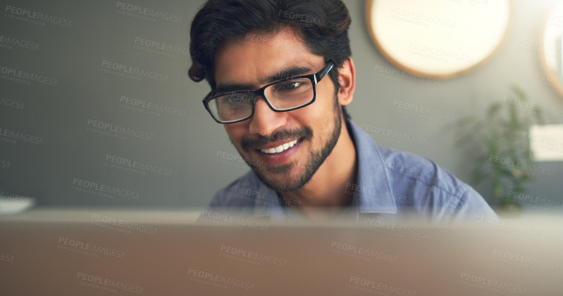 Buy stock photo Cropped shot of a handsome young businessman working at home