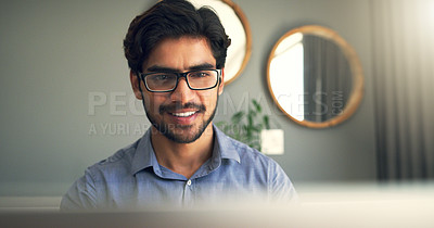 Buy stock photo Cropped shot of a handsome young businessman working at home