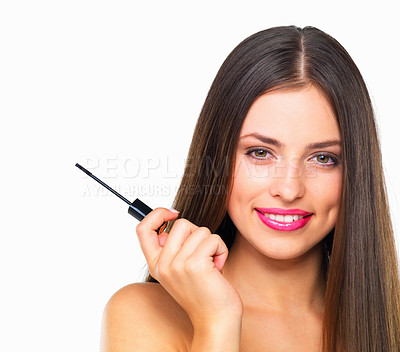 Buy stock photo Studio portrait of a beautiful young woman holding a mascara wand against a white background