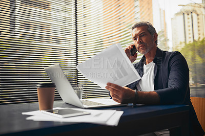 Buy stock photo Cropped shot of a mature businessman on a call in the office