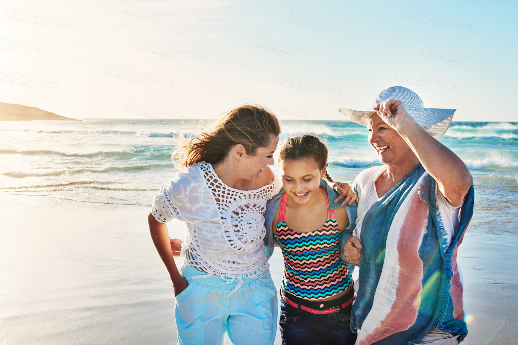 Buy stock photo Beach, travel and grandmother, mom and child by sea for bonding, weekend and relax in nature. Family, generation and happy grandparent, mother and girl by ocean for holiday, vacation and adventure