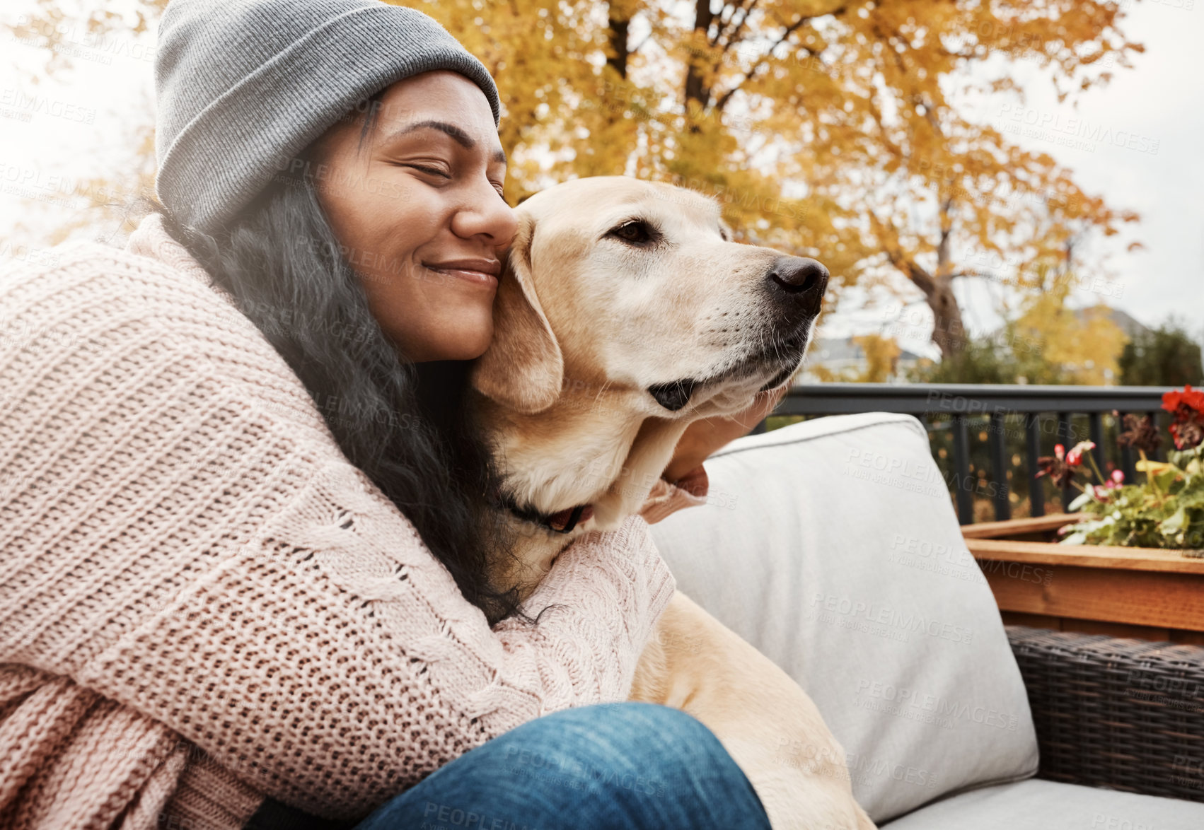 Buy stock photo Woman, smile and hug with dog in outdoor for bonding, relax together and calm morning in home. Pet owner, happy and labrador on patio couch with love embrace, rescue animal and support for friends