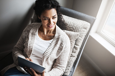 Buy stock photo Woman, thinking and tablet on couch for relax, internet and social media on weekend in home. Technology, mobile app and happy female person on sofa for reading, subscription and ebook in lounge 