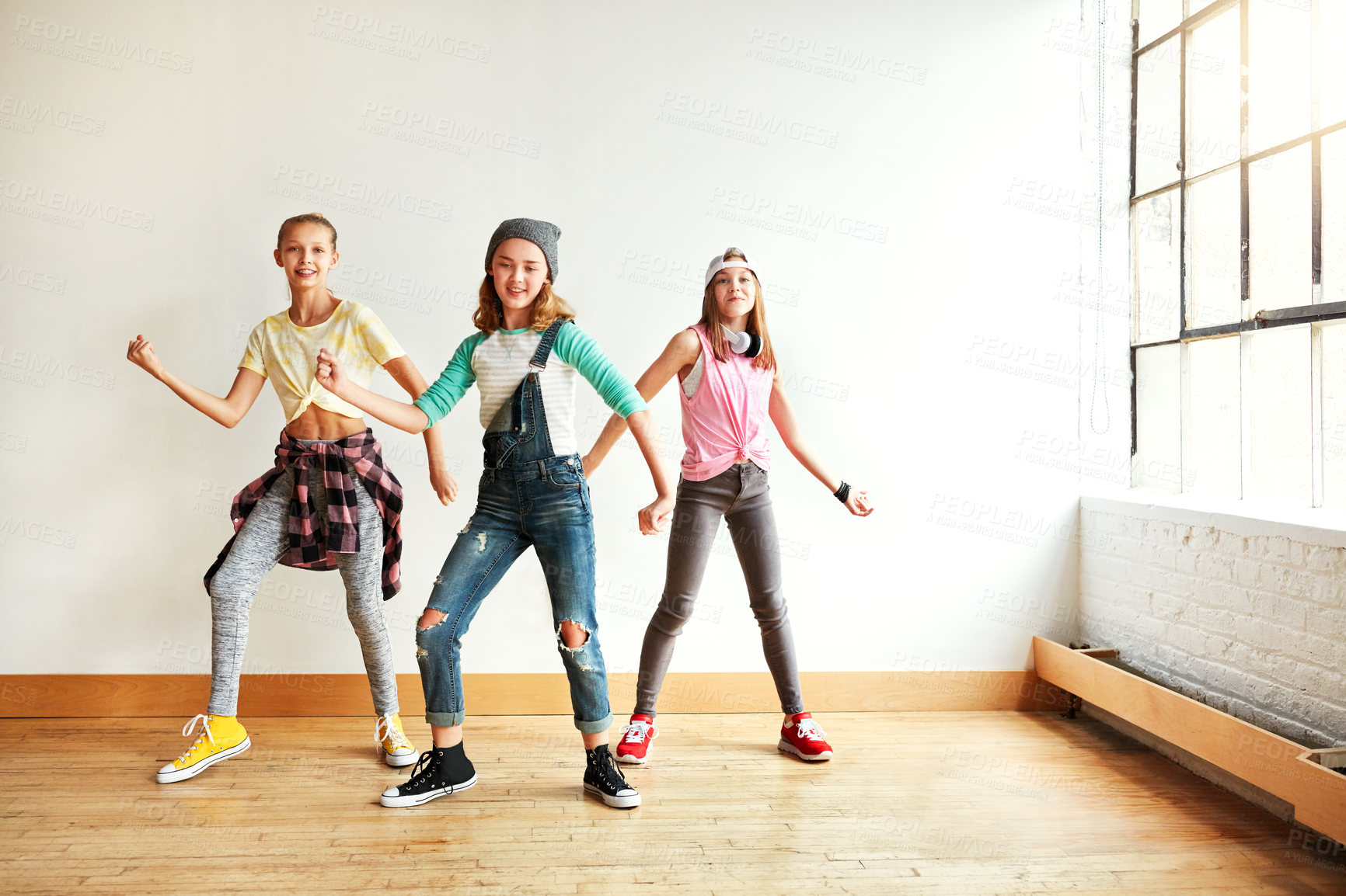 Buy stock photo Shot of young girls dancing in a dance studio
