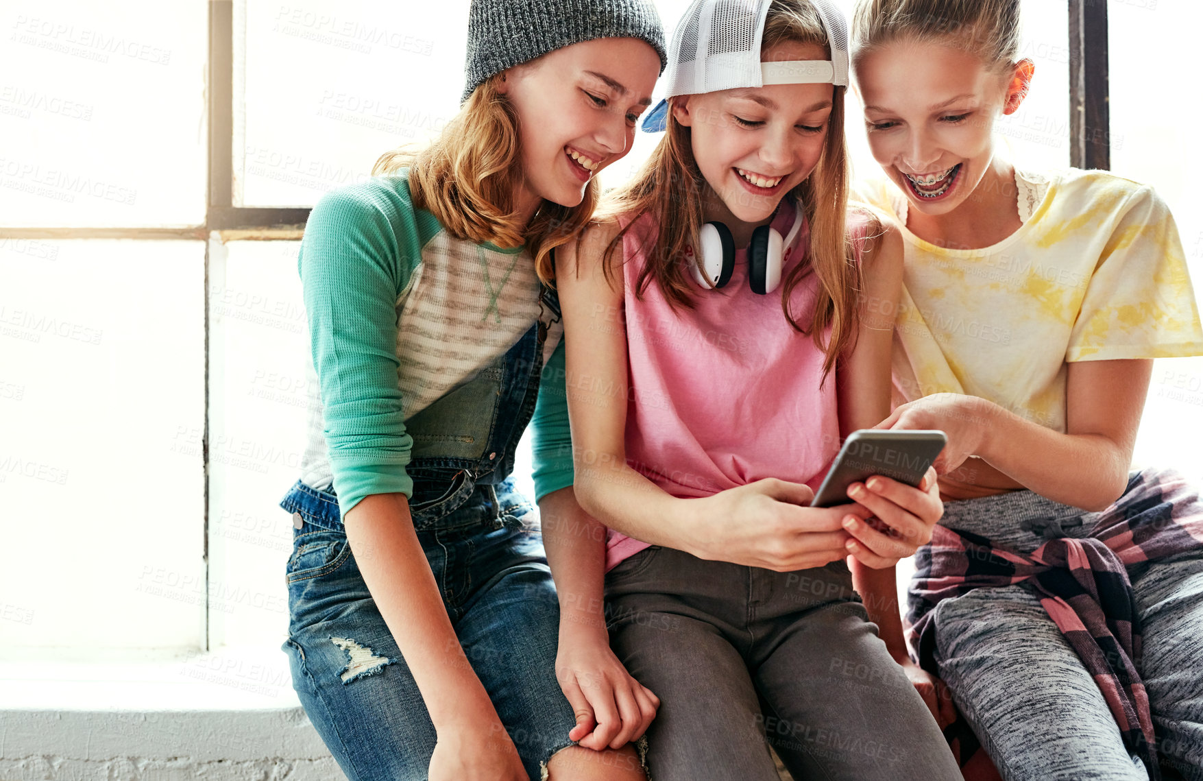 Buy stock photo Girl friends, teen group and phone for social media post, happy smile and bonding together in dancer studio. Teenager, female people and mobile application for watching dancing video, care or fashion