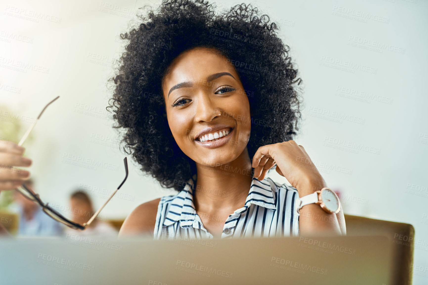 Buy stock photo Cropped shot of a young female designer working in a modern office