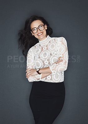 Buy stock photo Studio shot of a young attractive businesswoman posing against a grey background