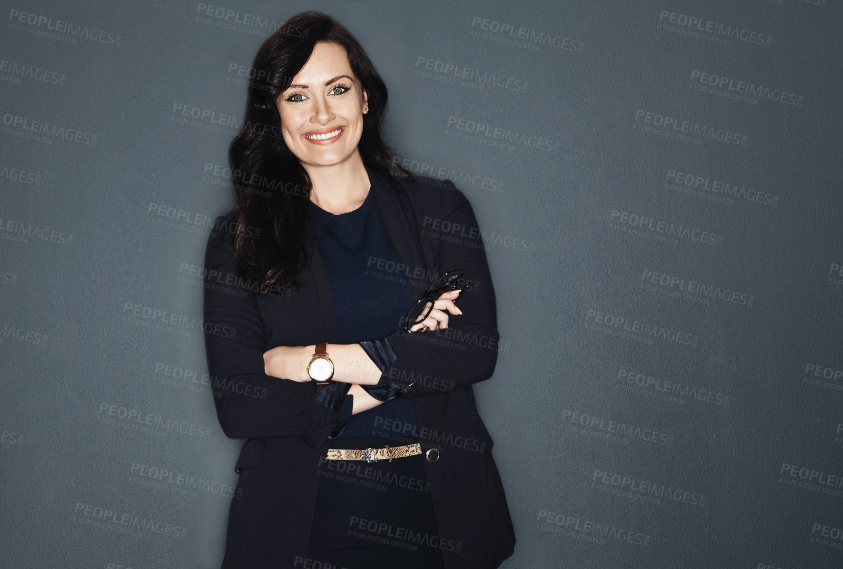 Buy stock photo Studio shot of a young attractive corporate businesswoman posing against a grey background