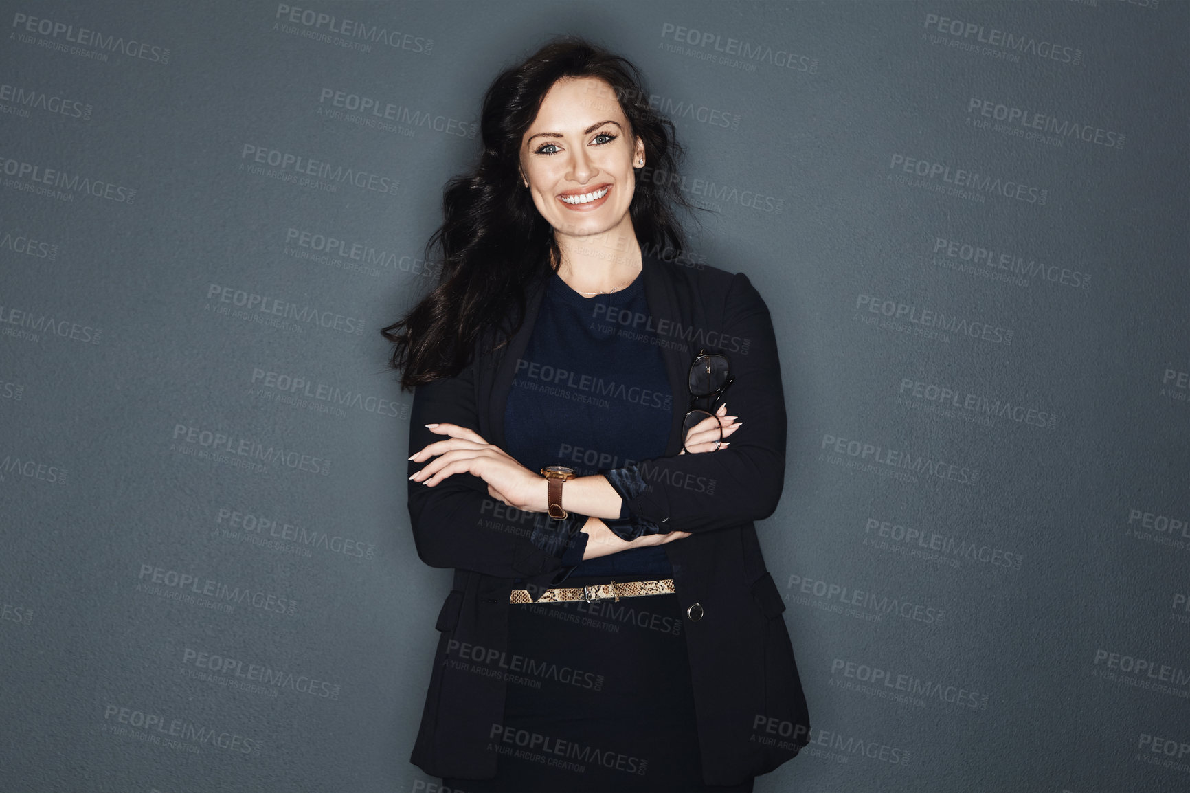 Buy stock photo Studio shot of a young attractive corporate businesswoman posing against a grey background