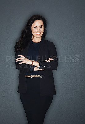 Buy stock photo Studio shot of a young attractive corporate businesswoman posing against a grey background