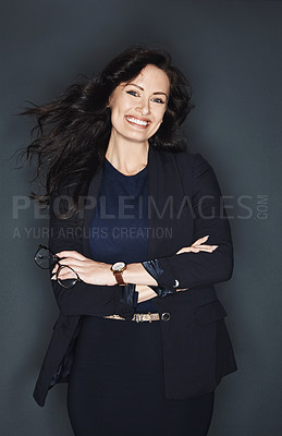 Buy stock photo Studio shot of a young attractive corporate businesswoman posing against a grey background