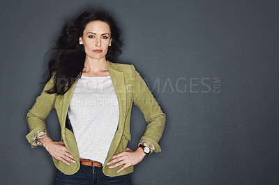 Buy stock photo Studio shot of a young attractive casual businesswoman posing against a grey background