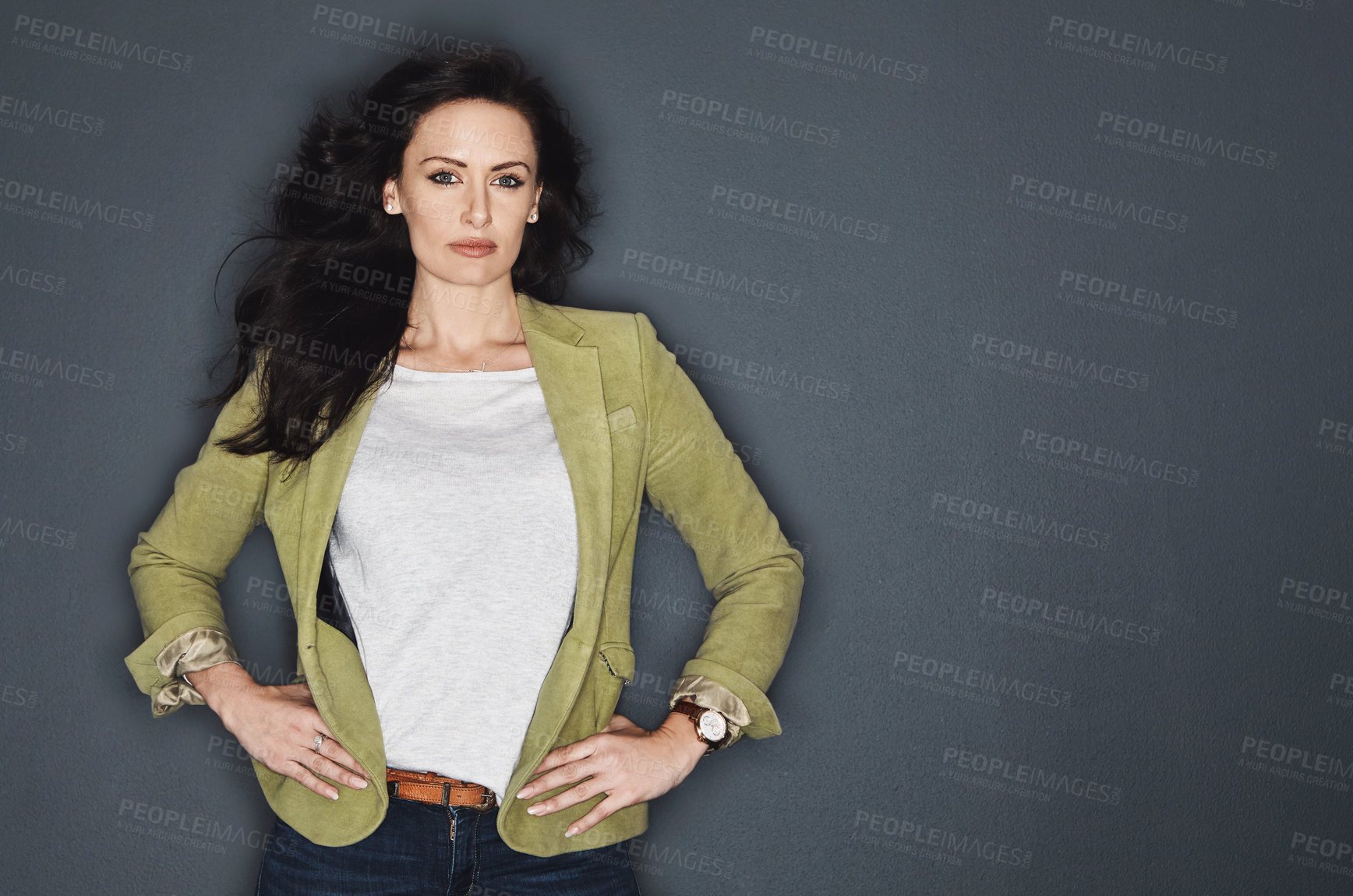 Buy stock photo Studio shot of a young attractive casual businesswoman posing against a grey background