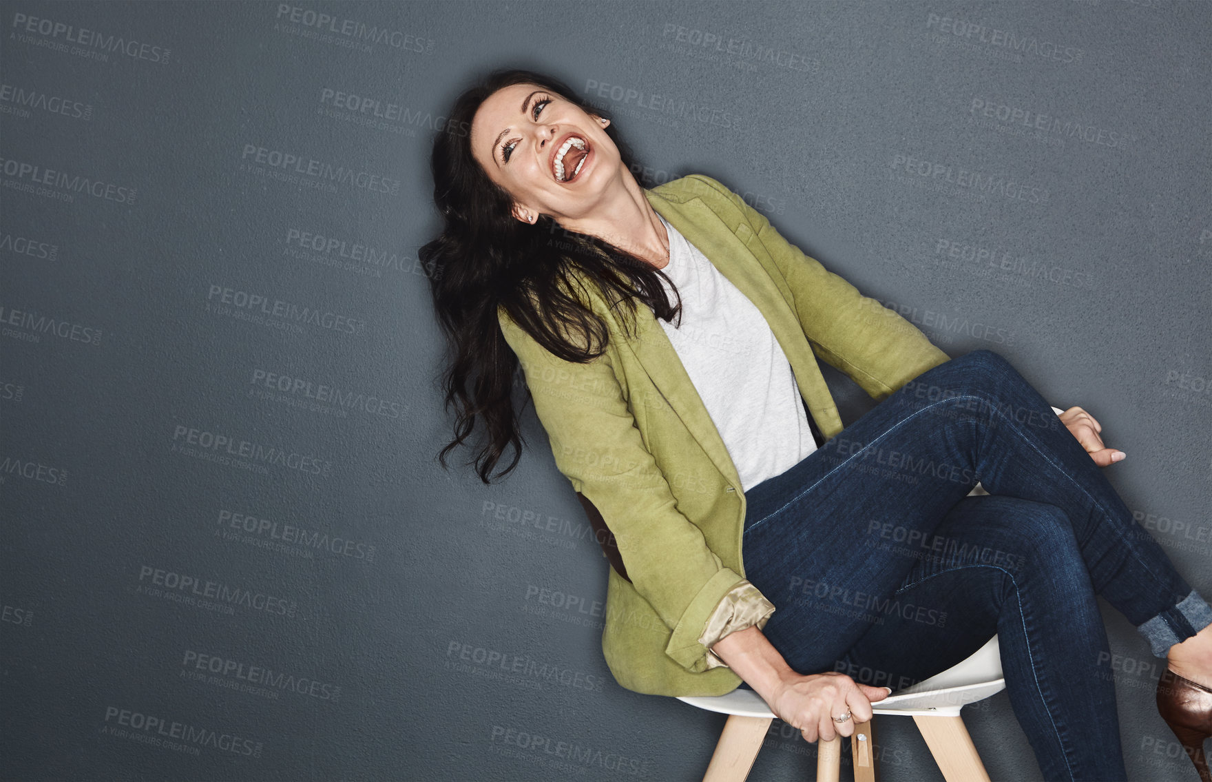 Buy stock photo Studio shot of a young attractive casual businesswoman posing against a grey background