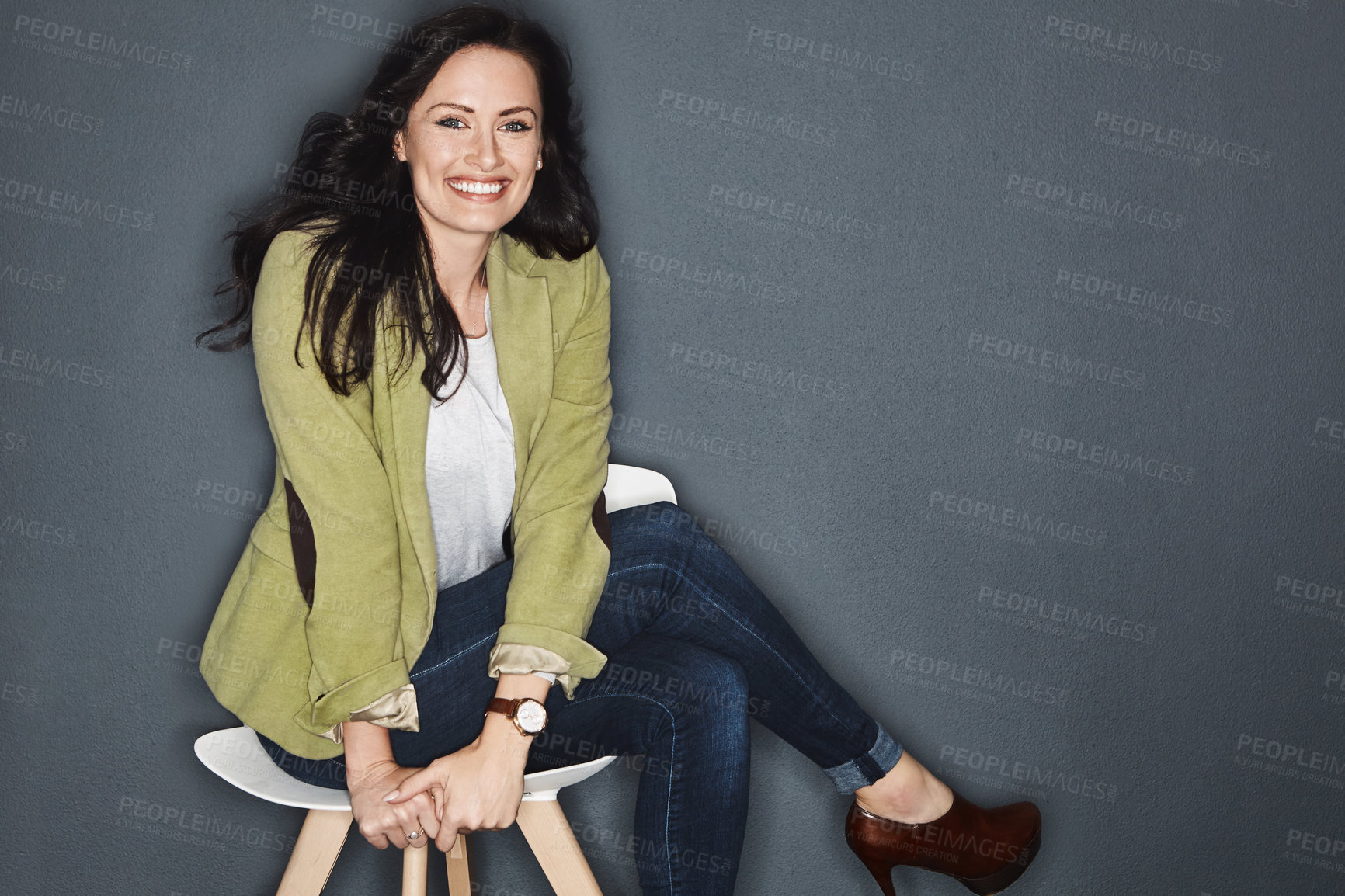 Buy stock photo Studio shot of a young attractive casual businesswoman posing against a grey background