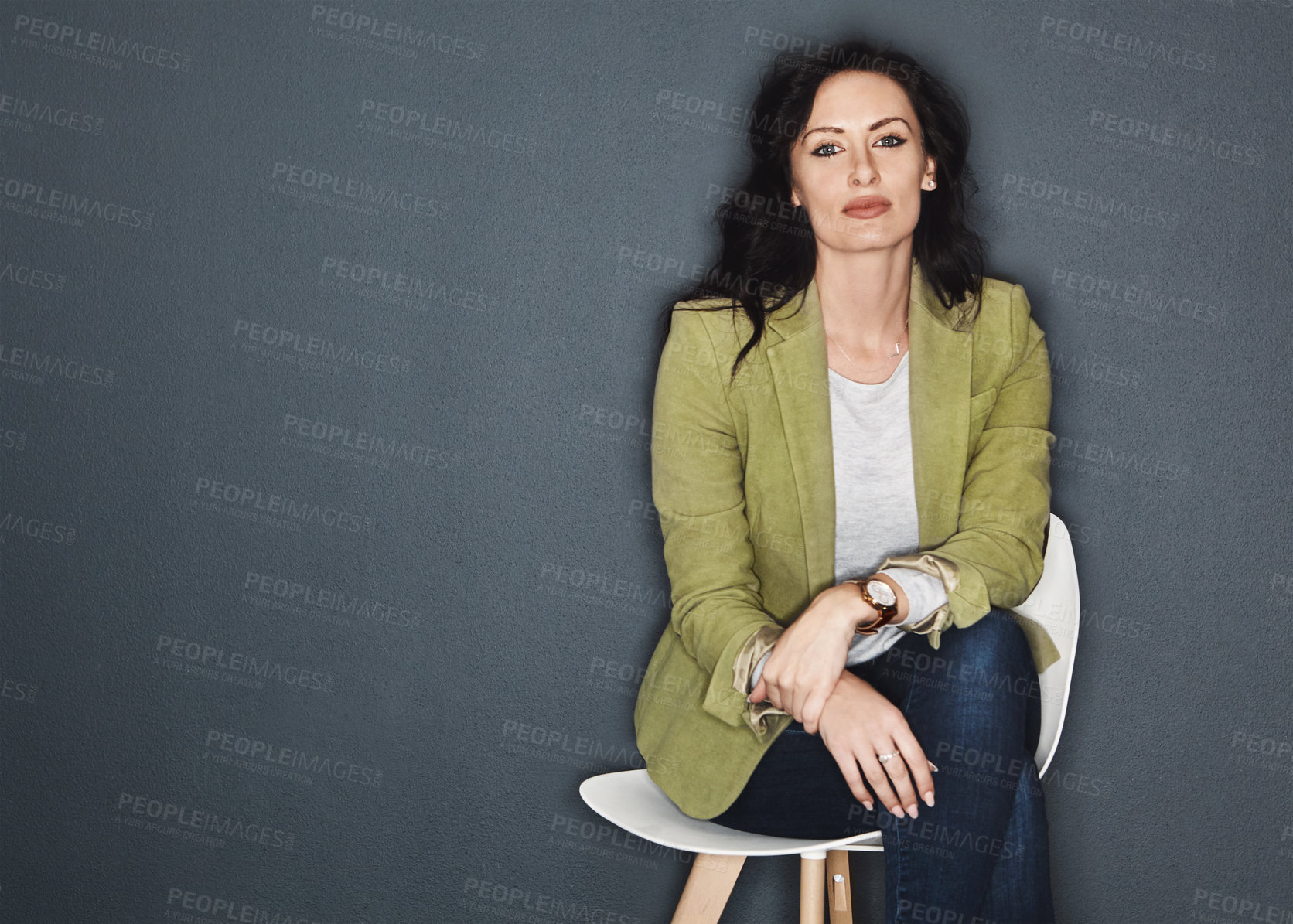 Buy stock photo Studio shot of a young attractive casual businesswoman posing against a grey background