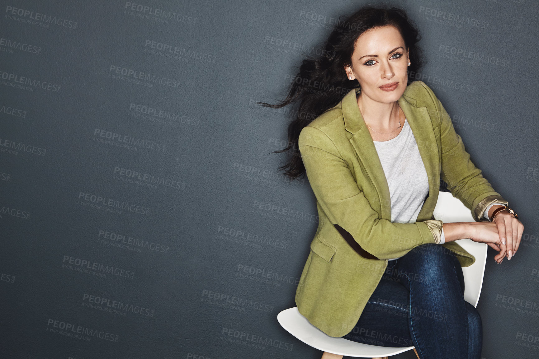 Buy stock photo Studio shot of a young attractive casual businesswoman posing against a grey background