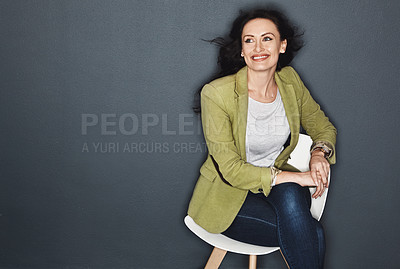 Buy stock photo Studio shot of a young attractive casual businesswoman posing against a grey background